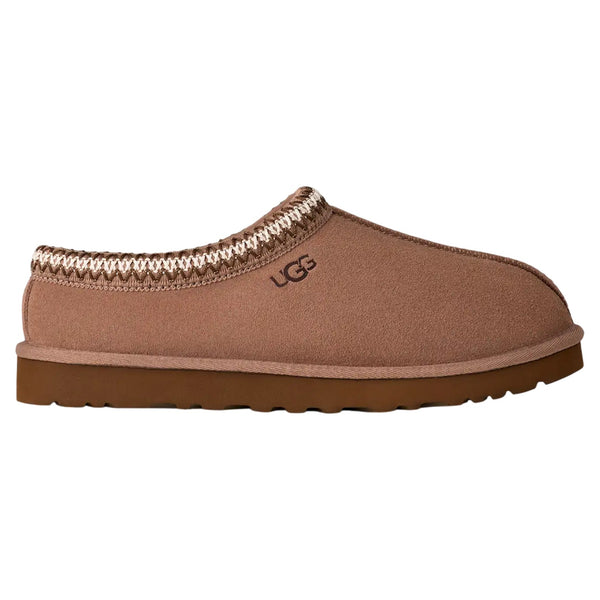 Brown UGG slipper on a white background