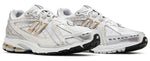 White running shoes with gold accents on a white background - Image 2
