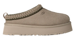 Beige slip-on shoe with platform sole on a white background - Image 1