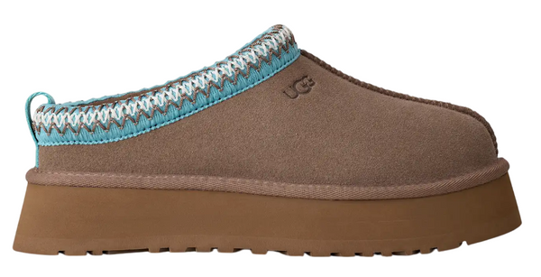 Brown slipper with a blue and white crocheted trim on a white background