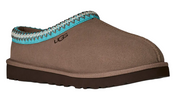 Brown UGG slipper with turquoise and silver trim on a white background