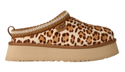 Leopard print slip-on shoe with a beige platform sole on a white background