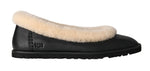 Black slipper with beige fur lining on a white background - Image 1