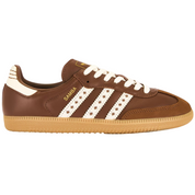 Brown Adidas sneaker with white stripes on a white background