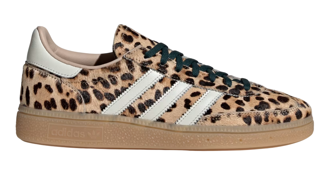 Leopard print sneaker with white stripes on a white background