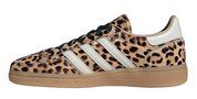 Leopard print sneaker with white stripes on a white background