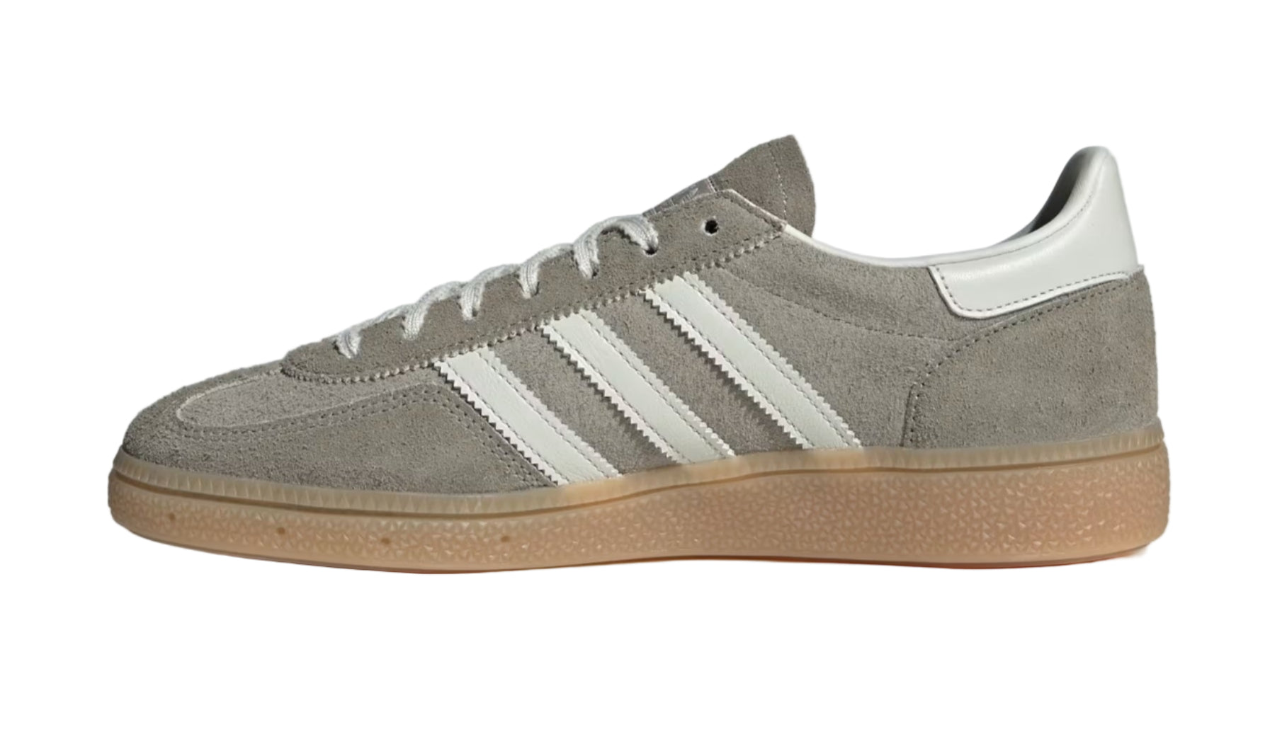 Gray Adidas sneaker with white stripes on a light gray background