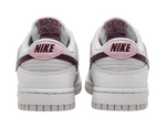 White Nike sneakers with pink swoosh logo on a white background - Image 3