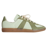 Green and white sneaker with brown sole on a white background - Image 1