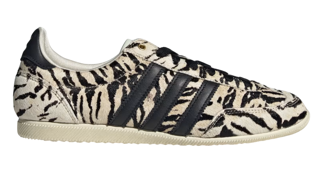 Zebra-patterned sneaker with black stripes on a white background