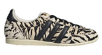 Zebra-patterned sneaker with black stripes on a white background - Image 1