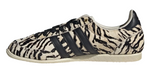 Sneaker with zebra pattern and three black stripes on a white background - Image 3