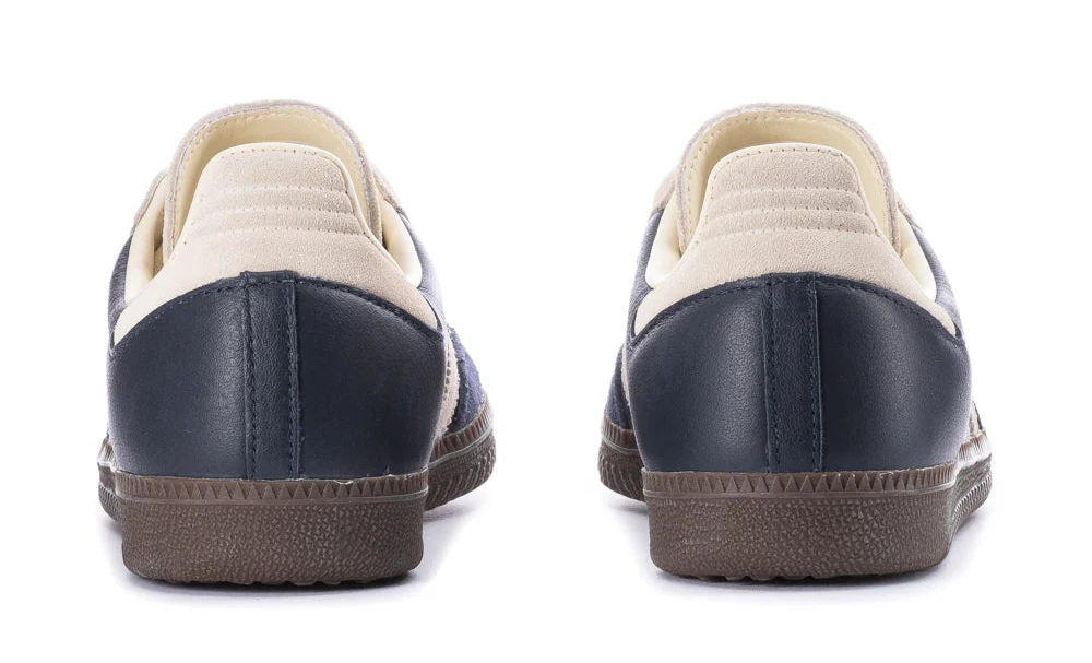 Navy and beige shoes on a white background