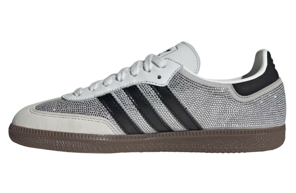 White Adidas sneaker with black stripes on a white background