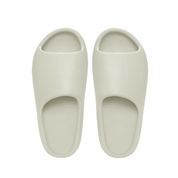 Pair of light gray slippers on a white background