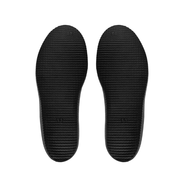 Black shoe insoles on a white background