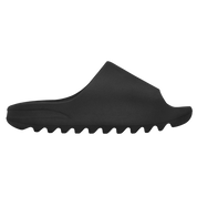 Black slip-on shoe with sole texture on a white background