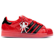 Red and black sneaker with a spider design on a white background