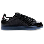 Black sneaker with blue sole on a white background - Image 3