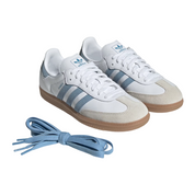 White Adidas sneakers with blue stripes and laces on a white background