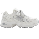 White sneaker with New Balance logo on a white background - Image 1