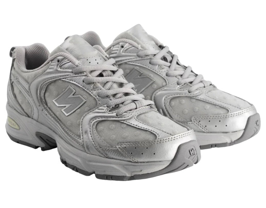 Pair of gray sneakers on a white background