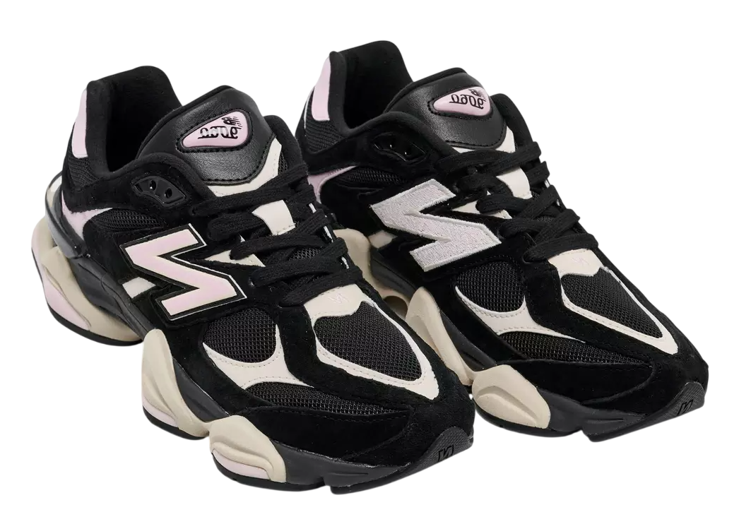 Black and white sneakers with New Balance logo on a white background