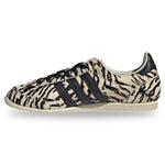 Sneaker with zebra pattern and three black stripes on a white background - Image 3