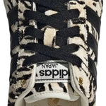 Sneaker with zebra pattern on a white background - Image 4
