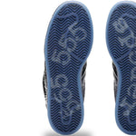 Close-up of the soles of a pair of shoes with a white background - Image 5