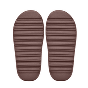 Pair of brown slippers on a white background