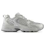 Gray sneaker with New Balance logo on a white background - Image 1