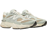 Pair of light gray sneakers with beige accents on a white background - Image 2