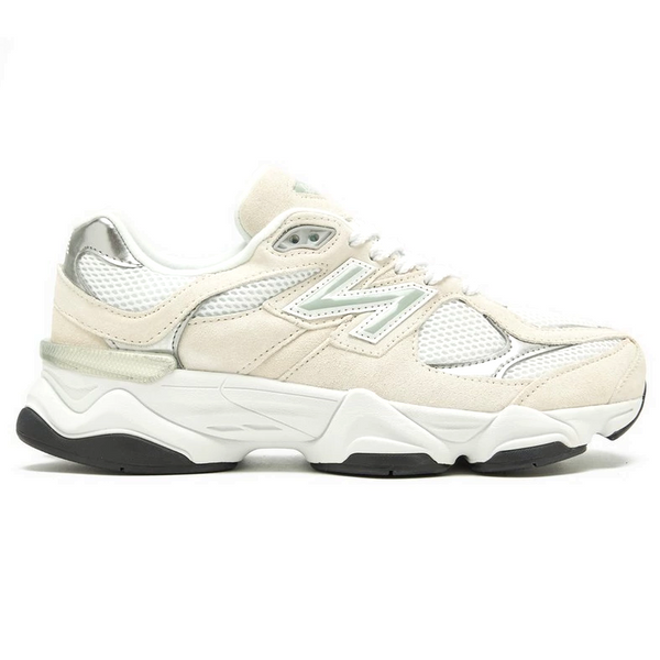 White sneaker with black sole on a white background