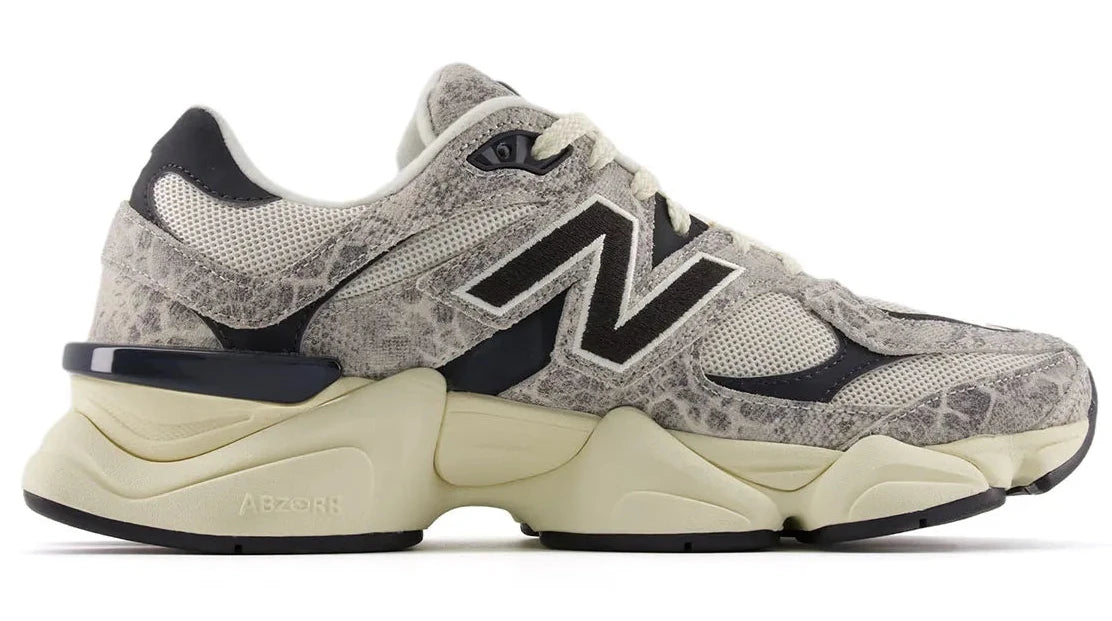 Gray and beige sneaker with black accents on a white background