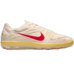 Beige sneaker with red Nike logo on a white background - Image 1