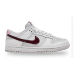 White sneaker with a maroon swoosh logo on a white background - Image 1