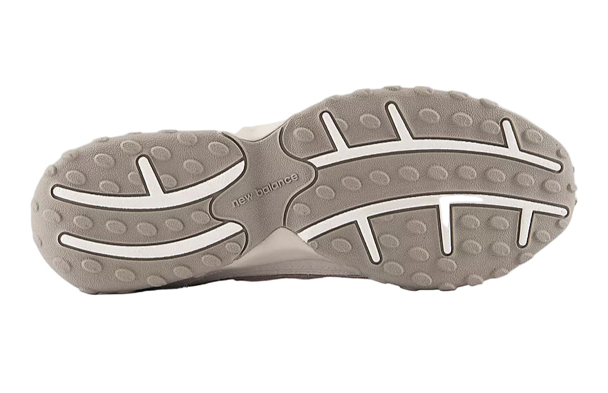 Close-up of a gray shoe sole with New Balance branding on a white background