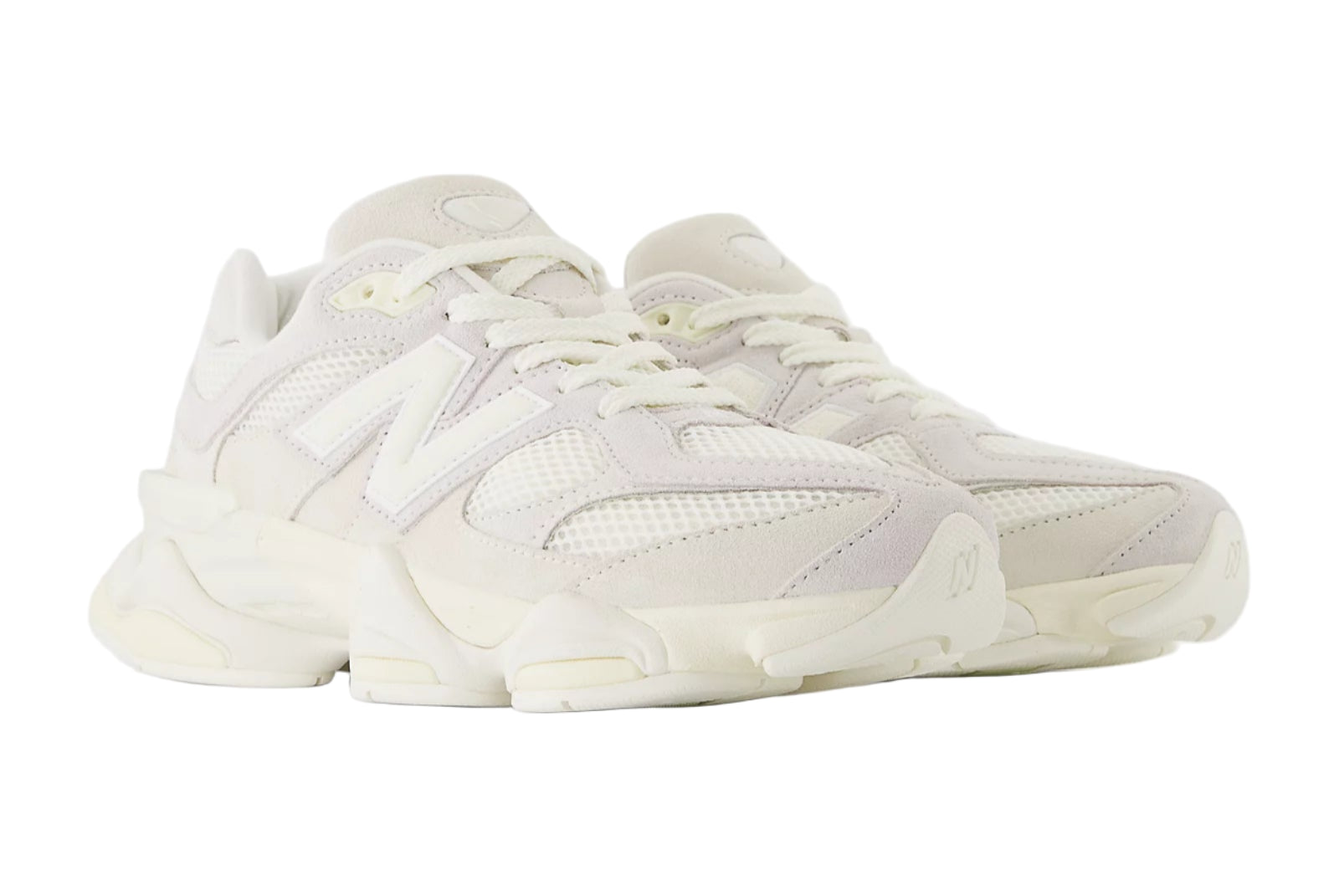 Pair of white sneakers on a light gray background