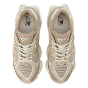 Pair of beige sneakers on a white background