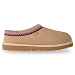 Tan UGG slipper with a white sole on a white background - Image 1